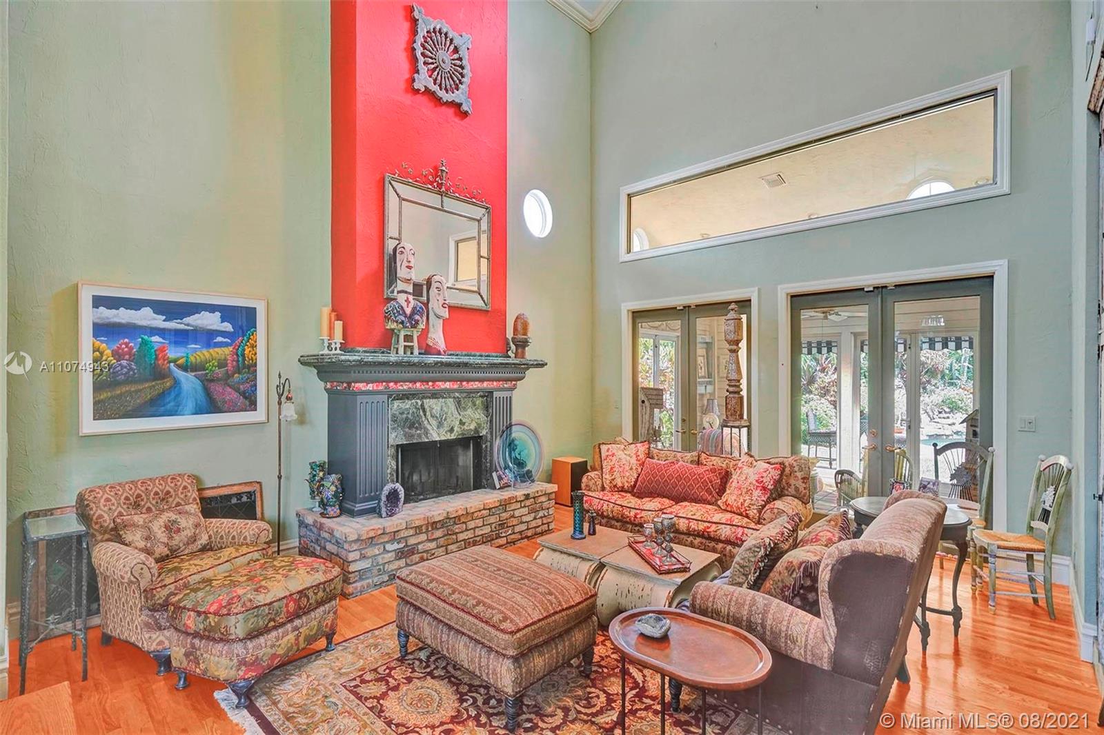 2705 Hackney Road Weston, FL 33331 - Photo 8 of 71 a living room with furniture a fireplace and wooden floor