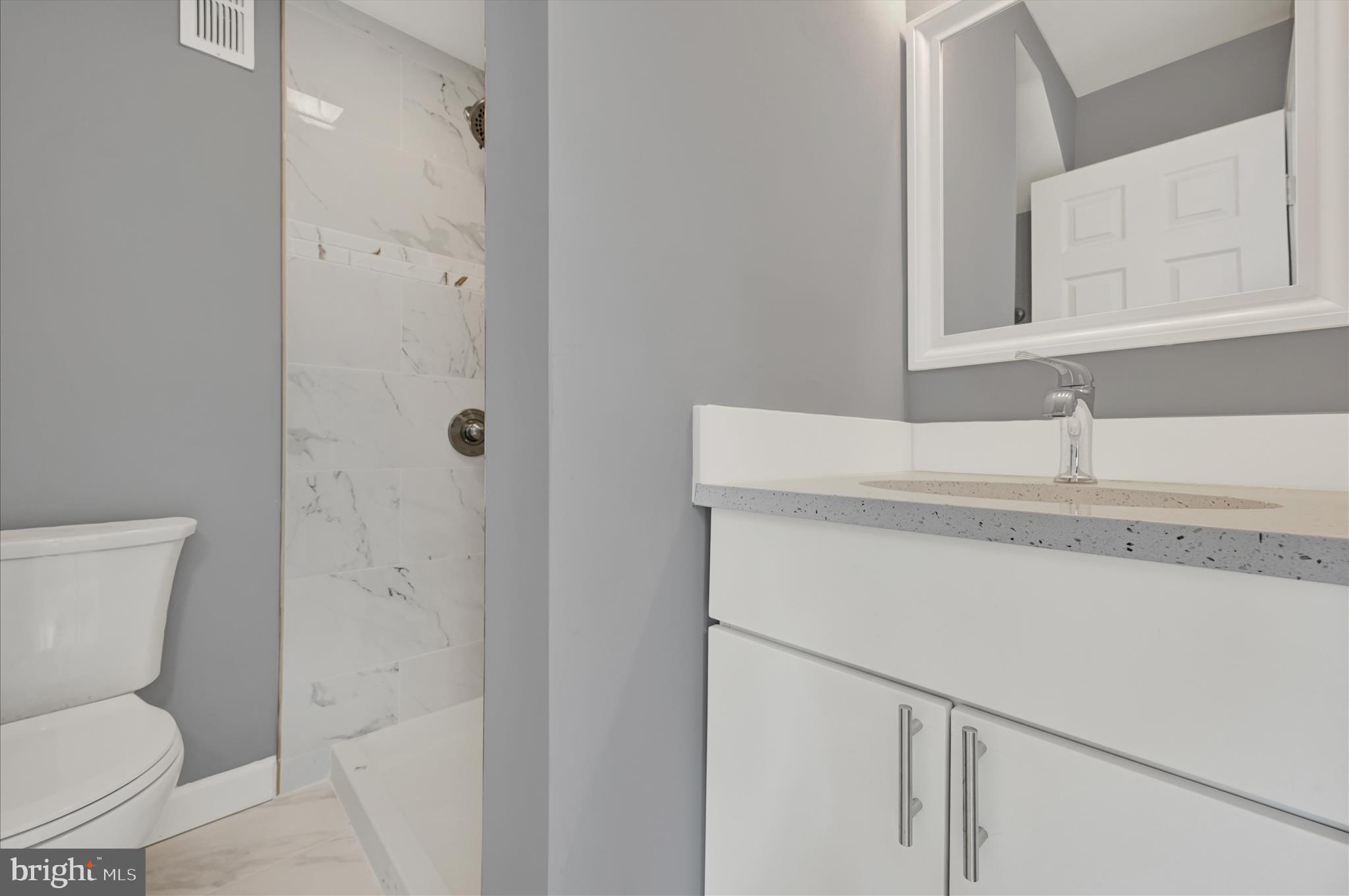 2 Armor Court Baltimore, MD 21220 - Photo 18 of 33 a bathroom with a sink toilet and shower