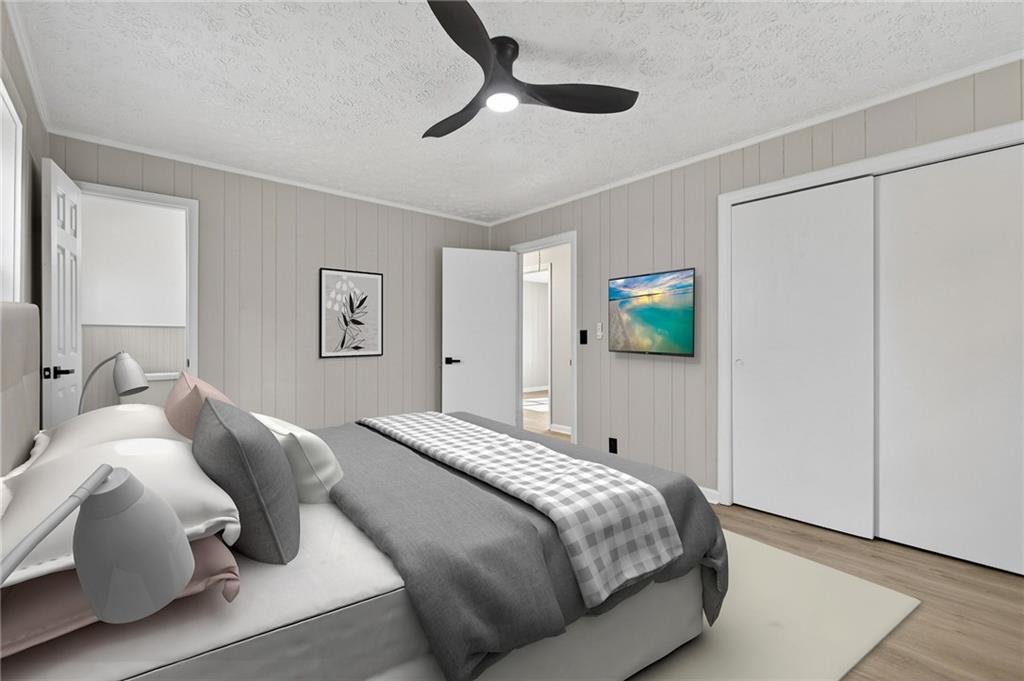 237 Lusk Court Canton, GA 30114 - Photo 15 of 25 a bedroom with a bed and a chandelier