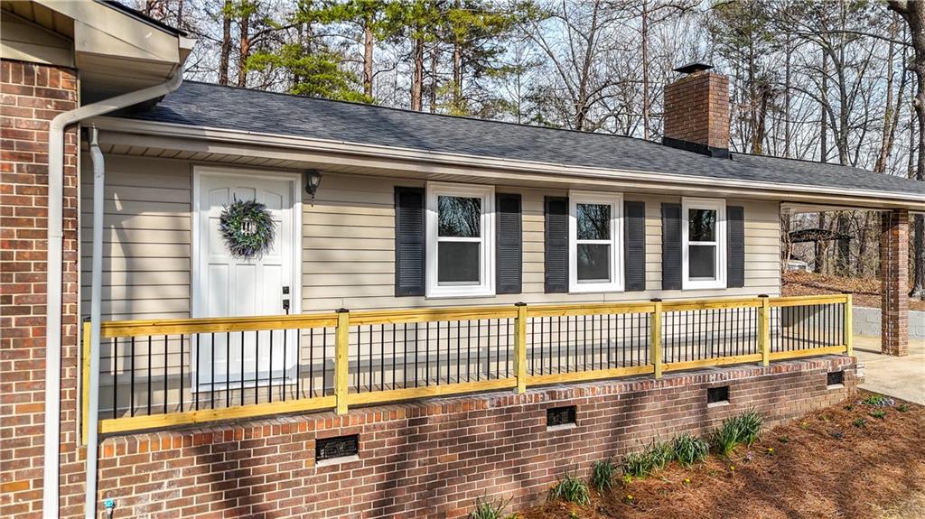 237 Lusk Court Canton, GA 30114 - Photo 20 of 25 a view of a house with wooden deck