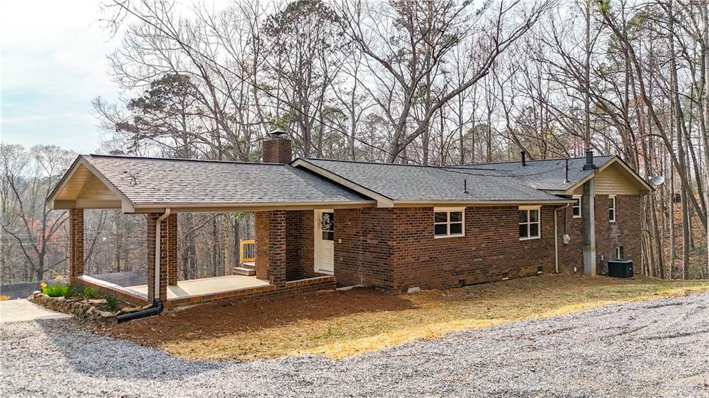 237 Lusk Court Canton, GA 30114 - Photo 21 of 25 a view of a house with a yard