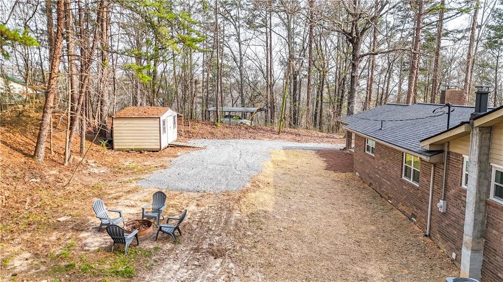237 Lusk Court Canton, GA 30114 - Photo 22 of 25 a backyard of a house with table and chairs