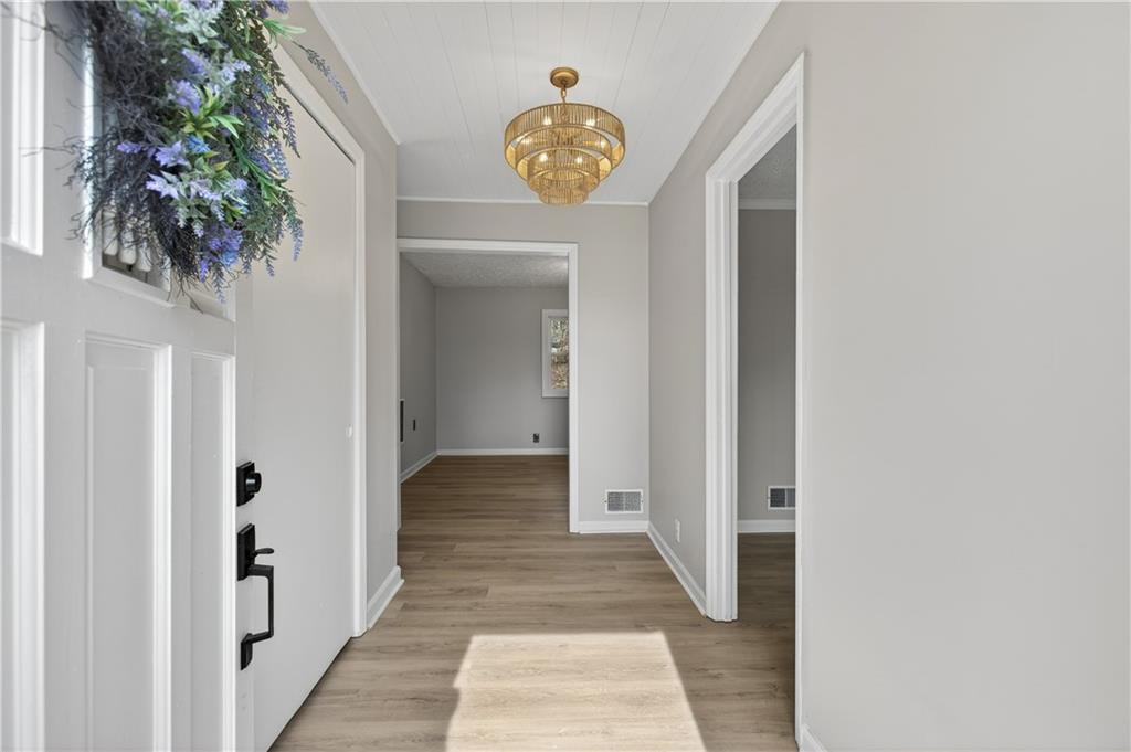 237 Lusk Court Canton, GA 30114 - Photo 3 of 25 a view of a hallway to a tree