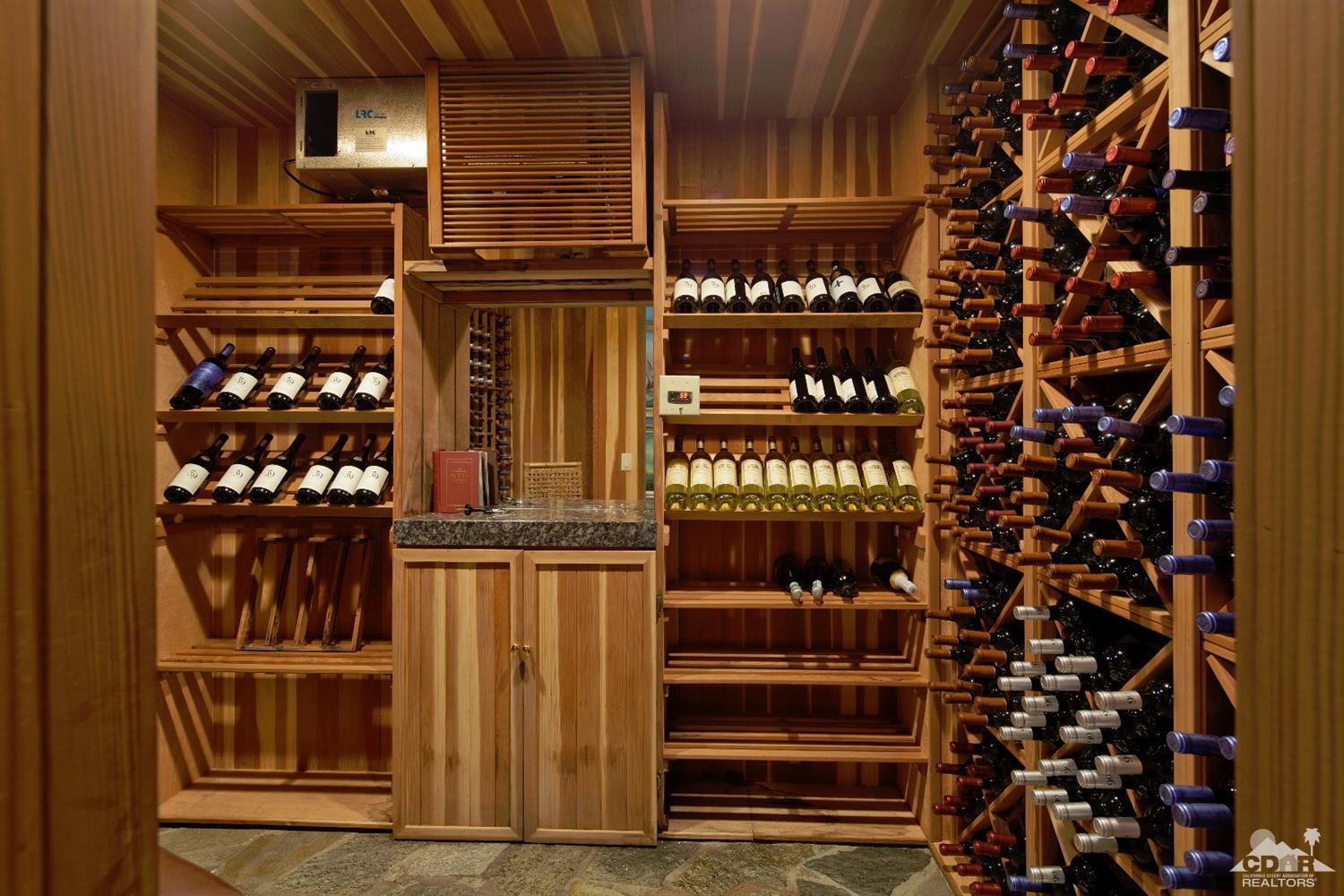 40815 Tonopah Road Rancho Mirage, CA 92270 - Photo 12 of 44 a view of a wooden door of the house