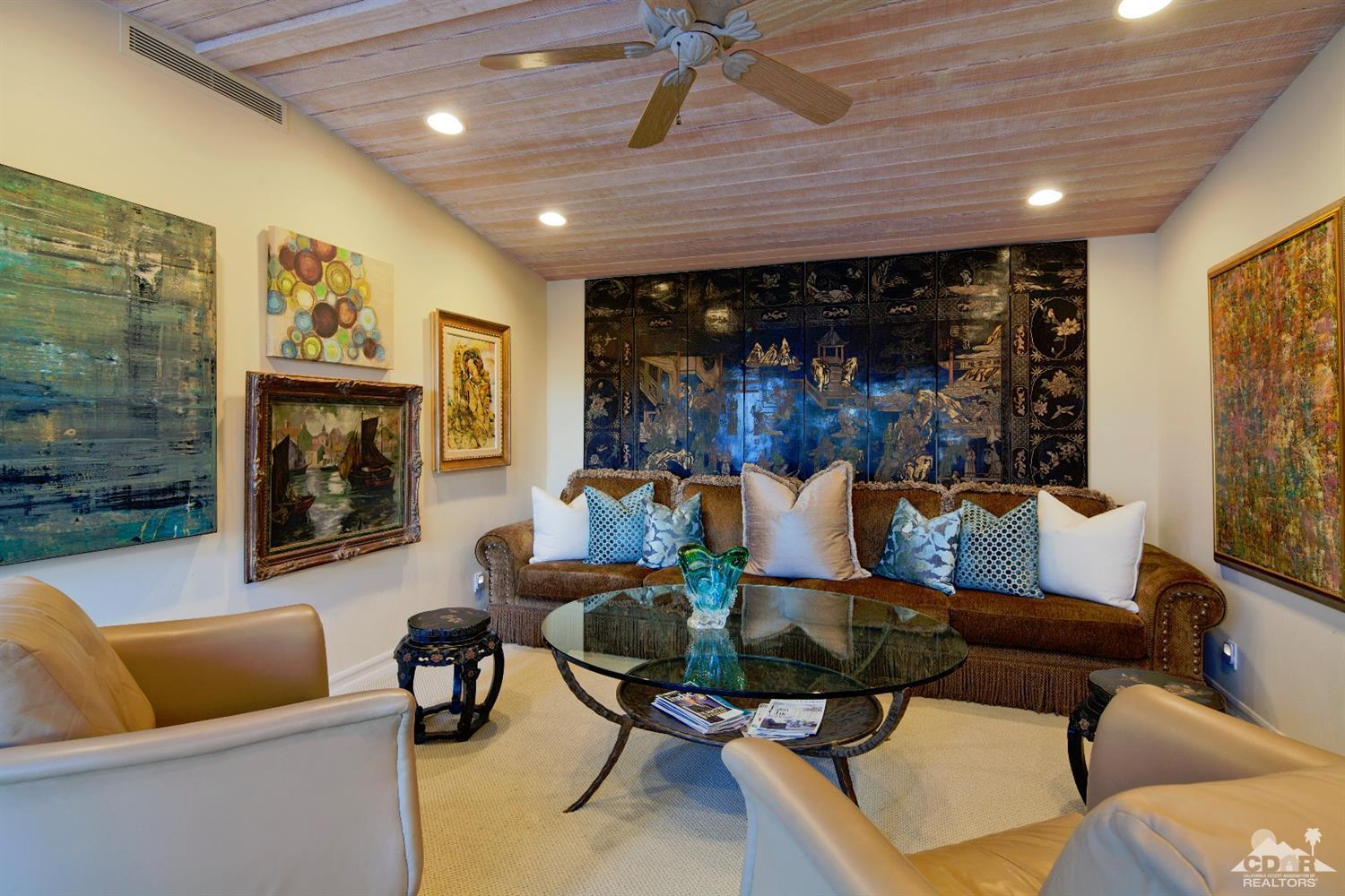 40815 Tonopah Road Rancho Mirage, CA 92270 - Photo 18 of 44 a living room with furniture and a fireplace