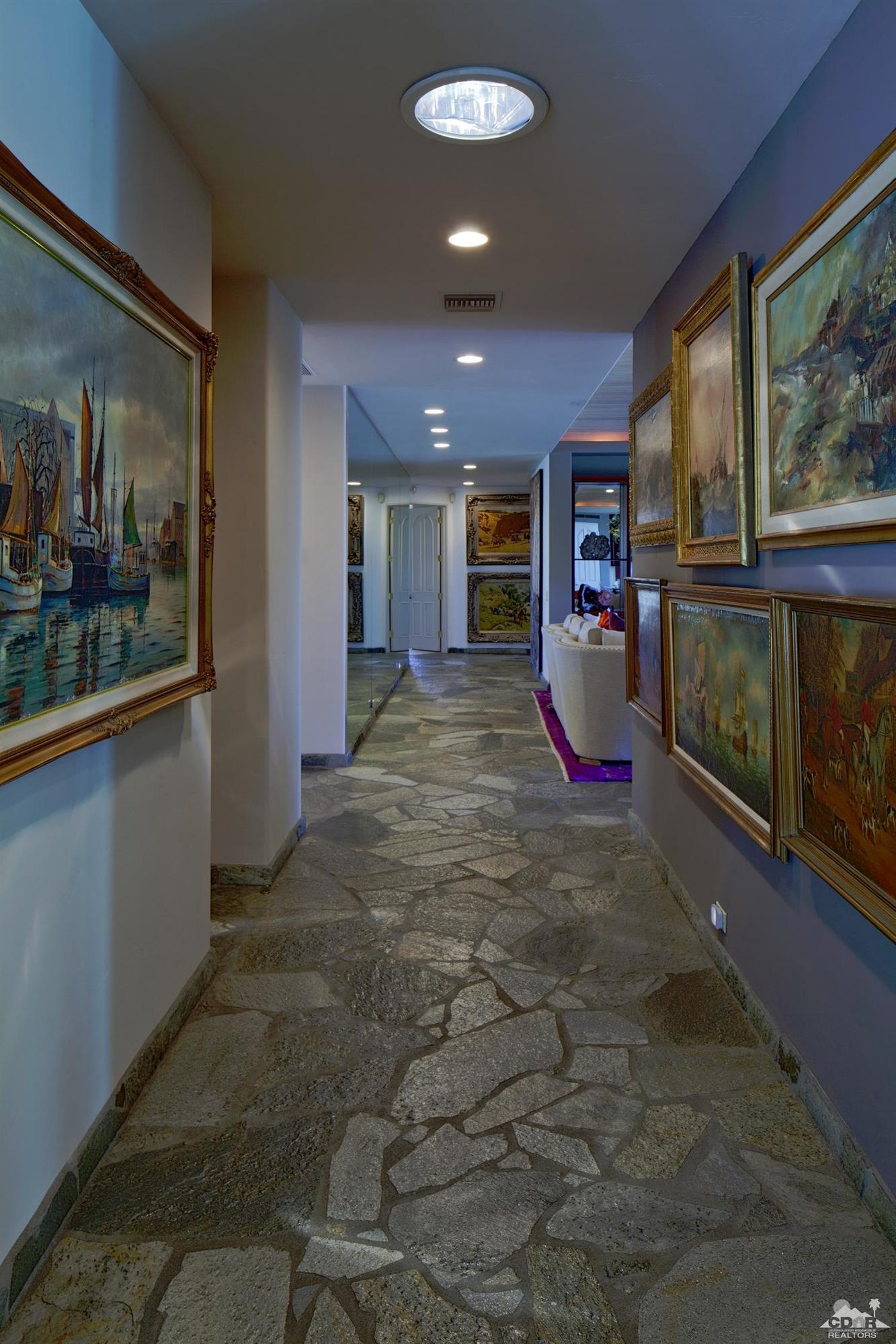 40815 Tonopah Road Rancho Mirage, CA 92270 - Photo 20 of 44 a view of a living room hardwood floor and a kitchen