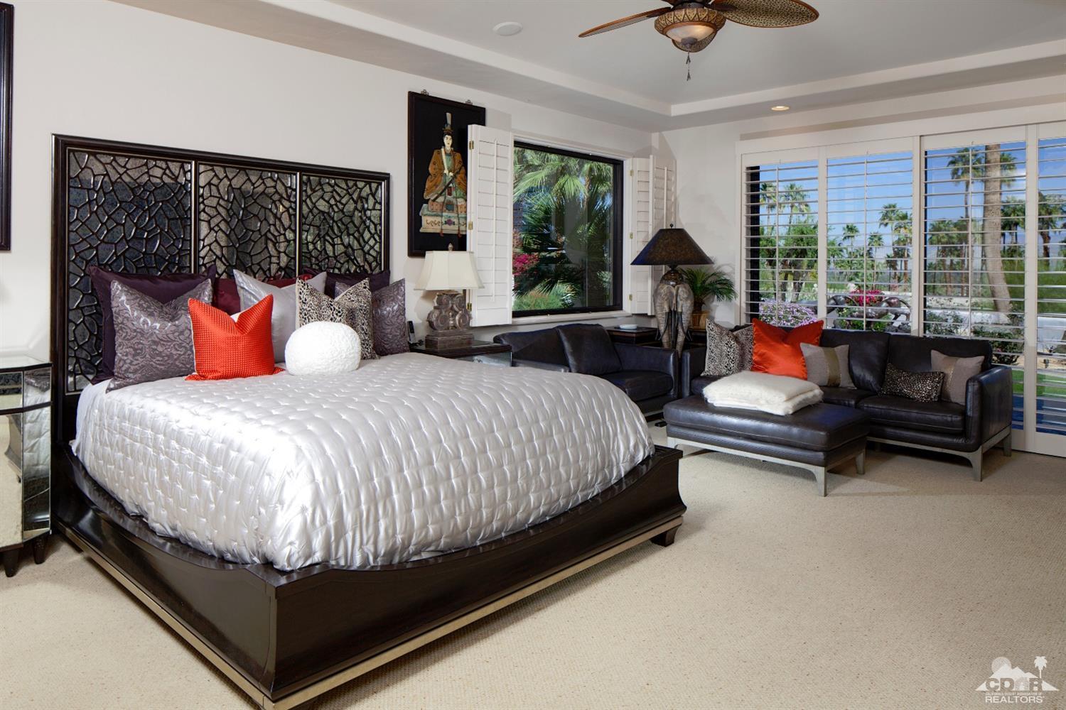 40815 Tonopah Road Rancho Mirage, CA 92270 - Photo 21 of 44 a living room with furniture and a large window