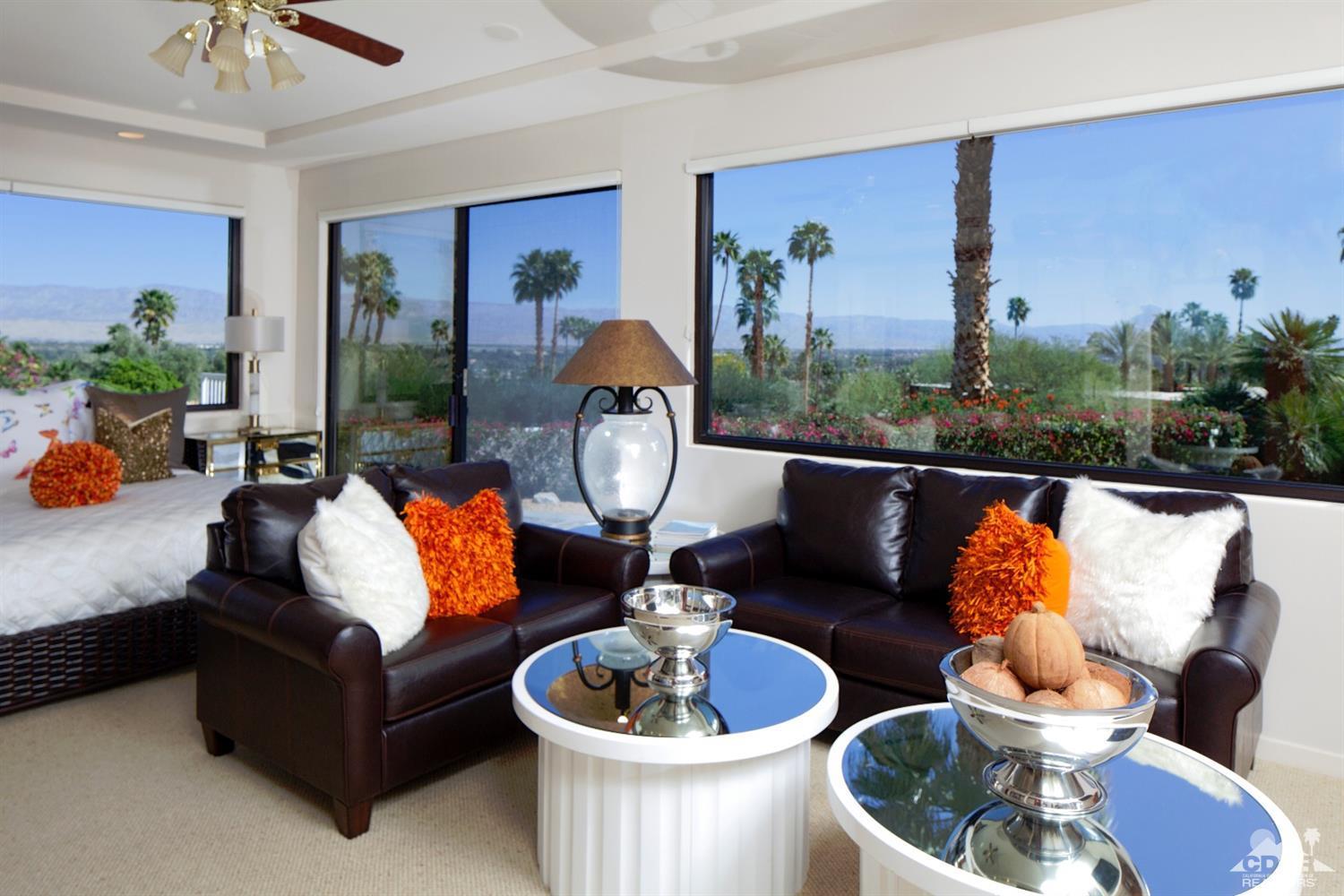 40815 Tonopah Road Rancho Mirage, CA 92270 - Photo 22 of 44 a living room with furniture and a potted plant