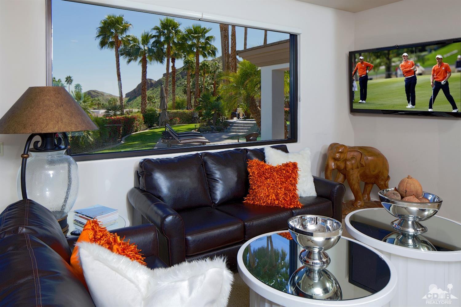40815 Tonopah Road Rancho Mirage, CA 92270 - Photo 23 of 44 a living room with furniture and a flat screen tv