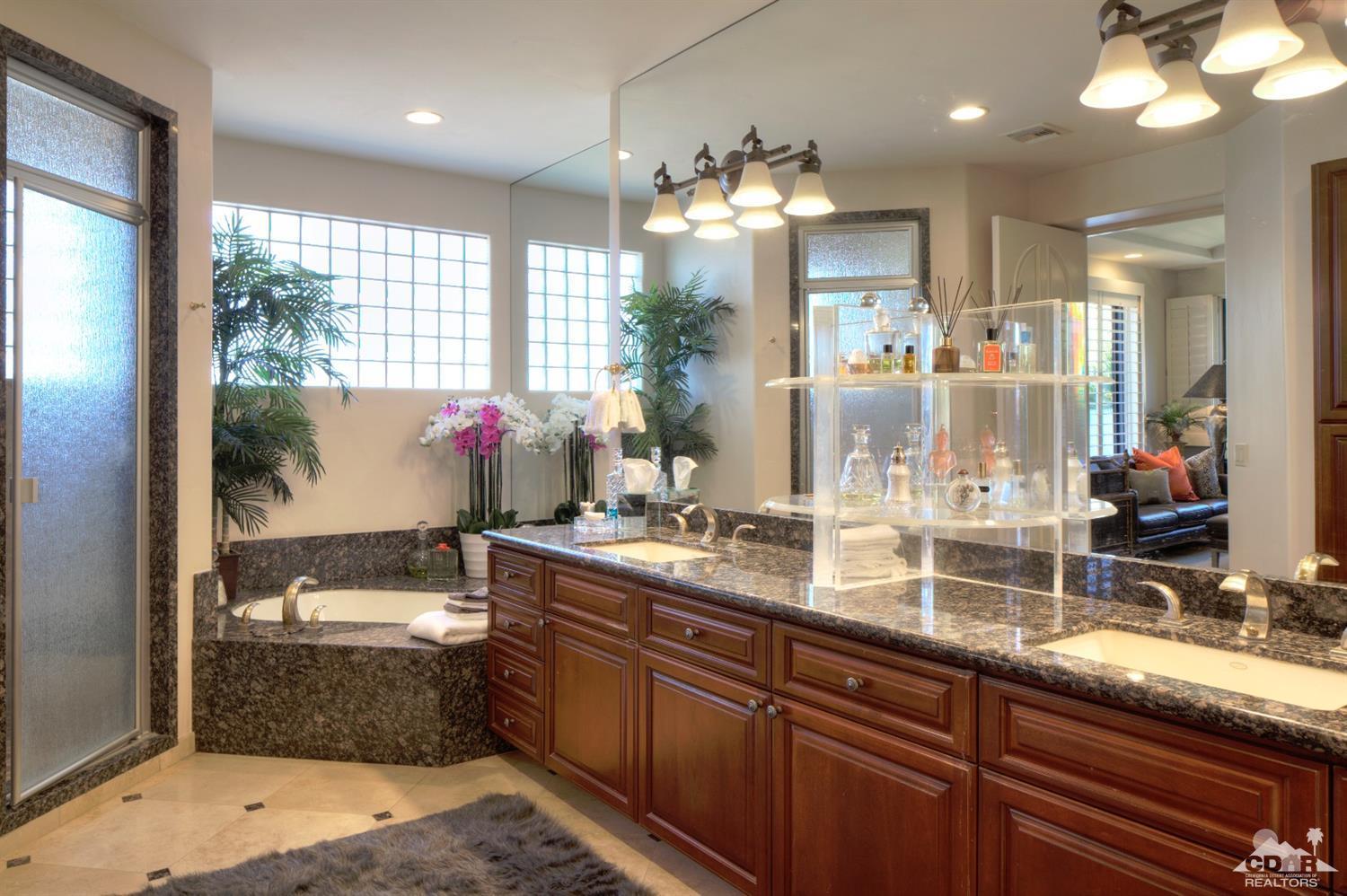 40815 Tonopah Road Rancho Mirage, CA 92270 - Photo 24 of 44 a large kitchen with kitchen island granite countertop a large island in the center