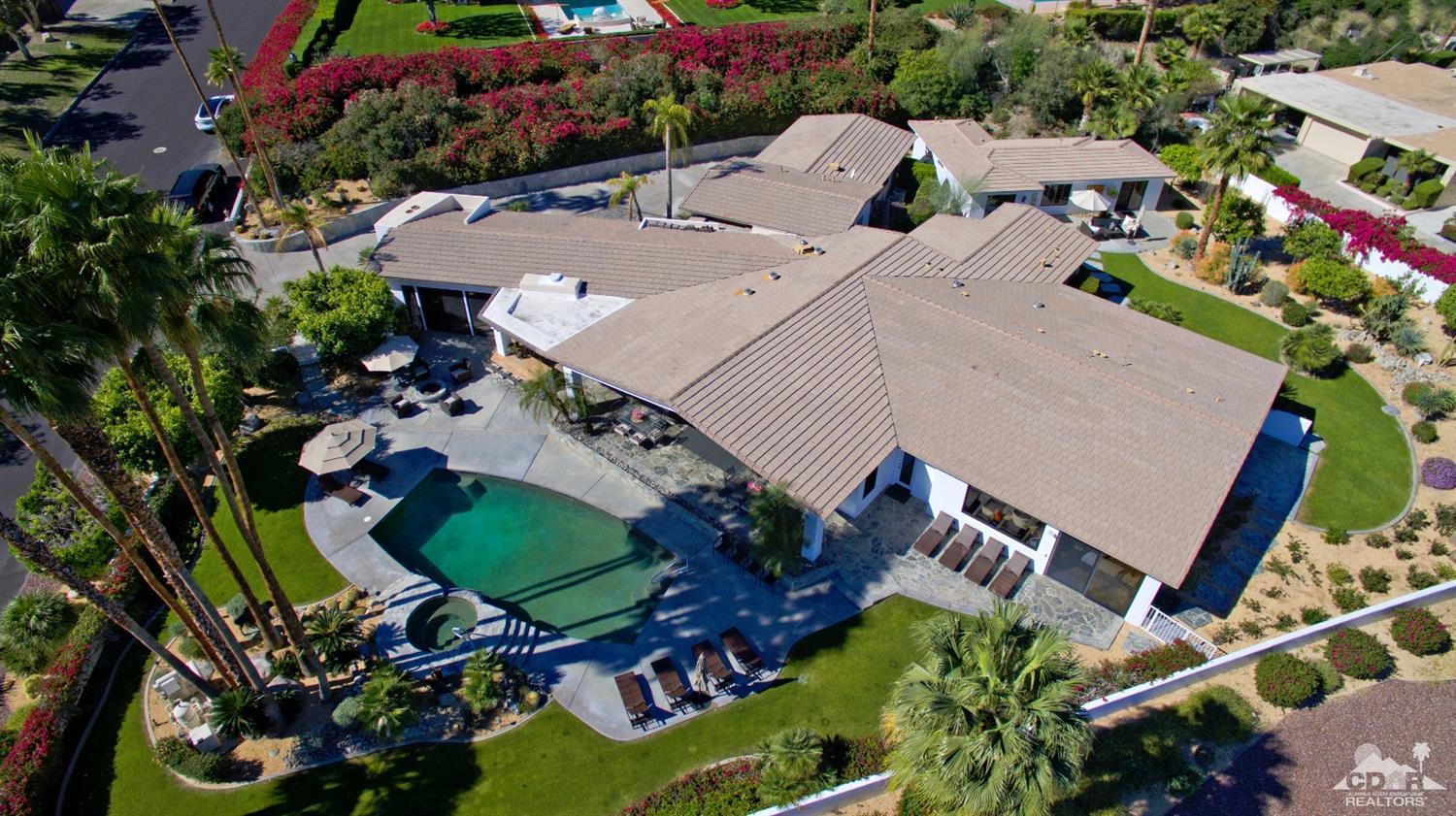 40815 Tonopah Road Rancho Mirage, CA 92270 - Photo 3 of 44 an aerial view of multiple houses with yard
