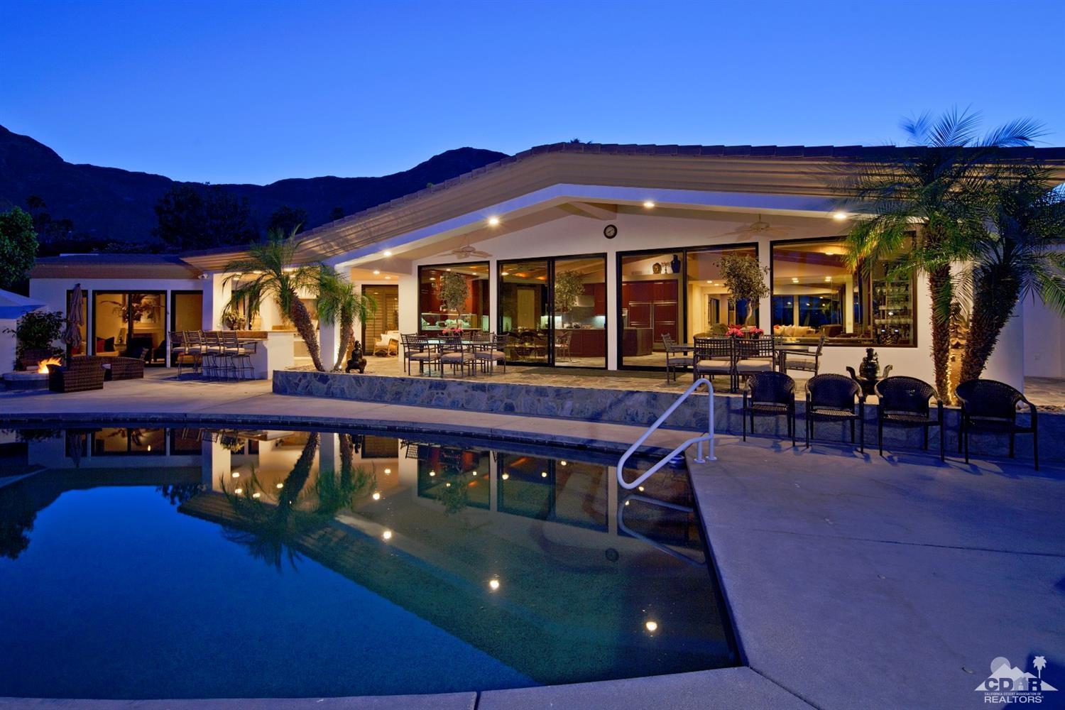 40815 Tonopah Road Rancho Mirage, CA 92270 - Photo 33 of 44 a view of a chairs and table in patio with a barbeque