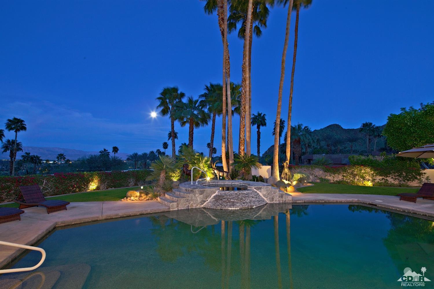 40815 Tonopah Road Rancho Mirage, CA 92270 - Photo 34 of 44 a view of a lake with a palm trees