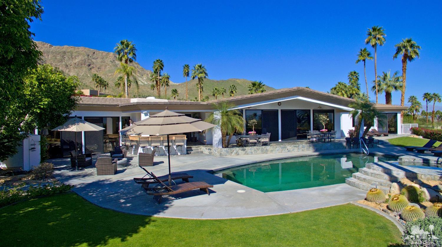 40815 Tonopah Road Rancho Mirage, CA 92270 - Photo 36 of 44 a view of a house with backyard porch and sitting area