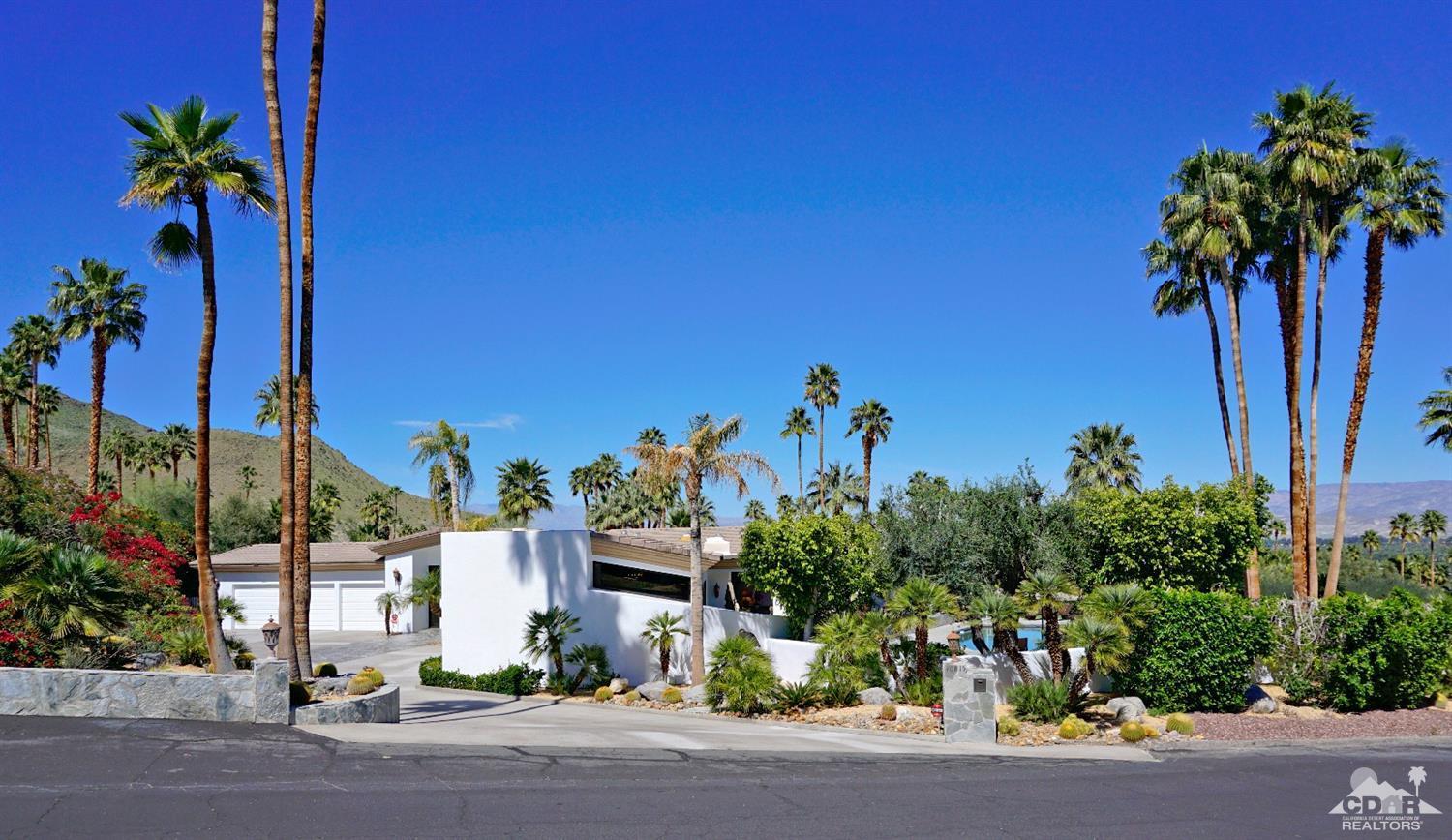 40815 Tonopah Road Rancho Mirage, CA 92270 - Photo 4 of 44 a view of a street with a building in the background