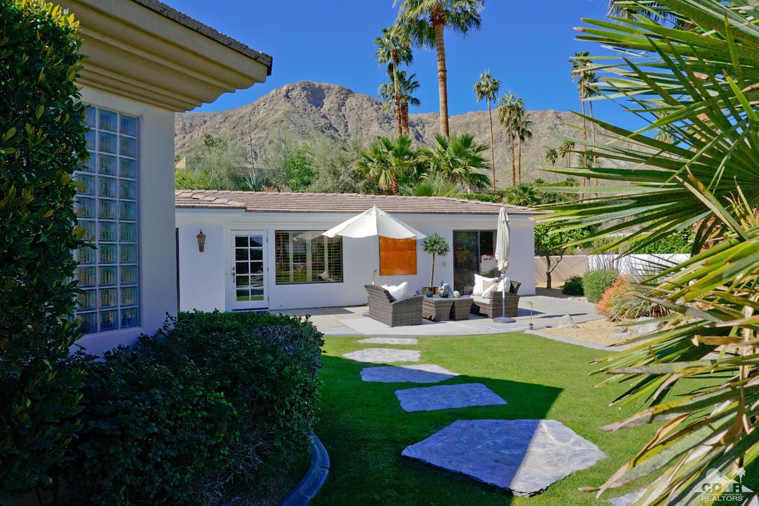 40815 Tonopah Road Rancho Mirage, CA 92270 - Photo 41 of 44 a view of swimming pool with outdoor seating and plants