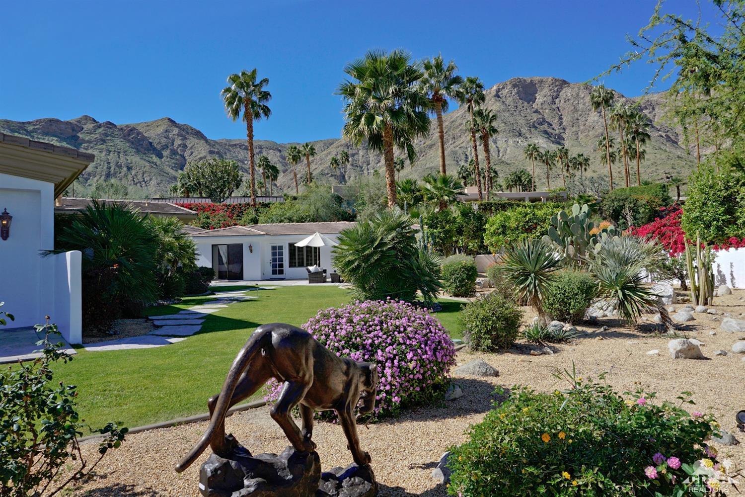 40815 Tonopah Road Rancho Mirage, CA 92270 - Photo 42 of 44 a view of a house with a yard and garden