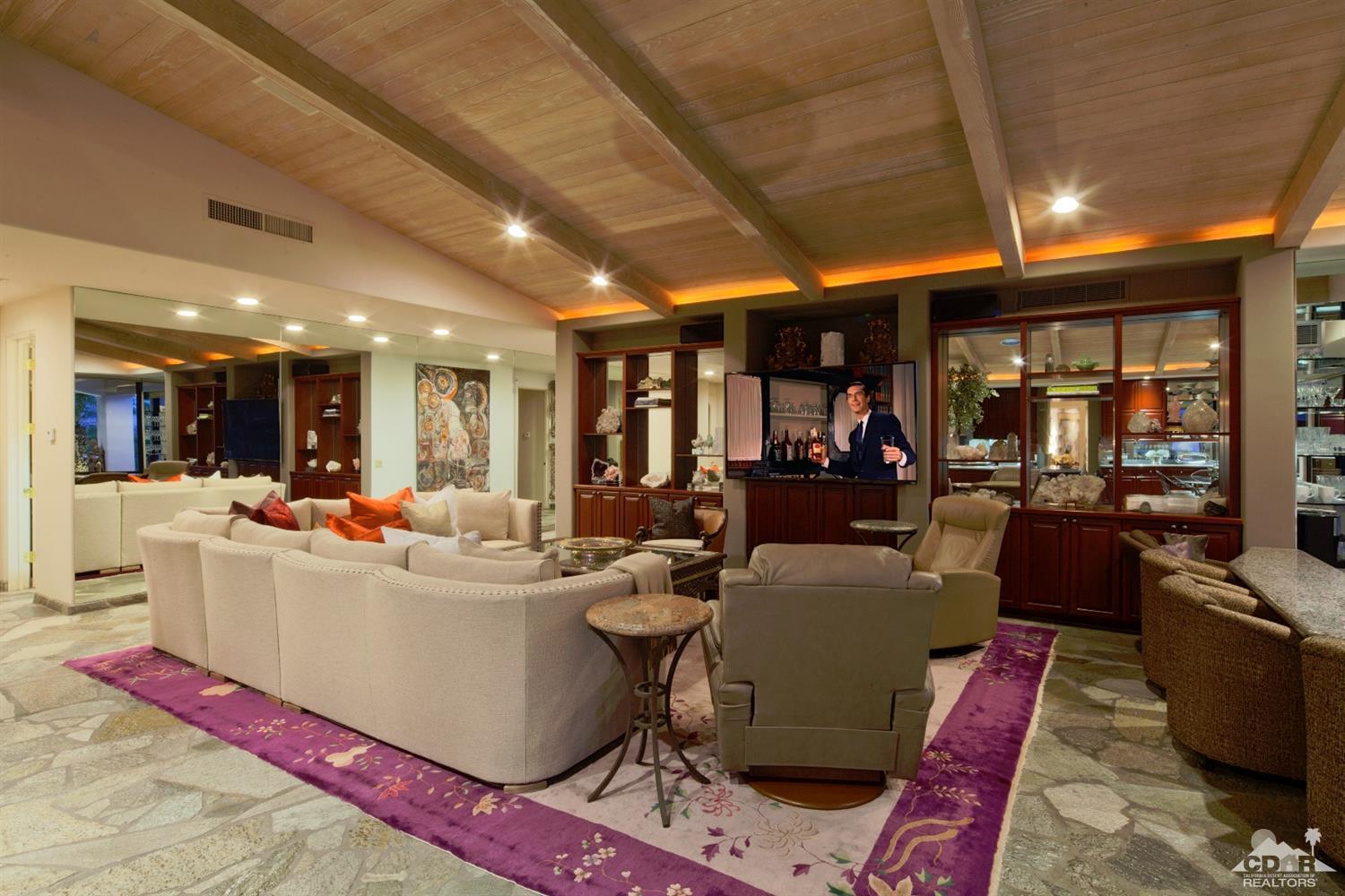 40815 Tonopah Road Rancho Mirage, CA 92270 - Photo 5 of 44 a living room with furniture and a large window