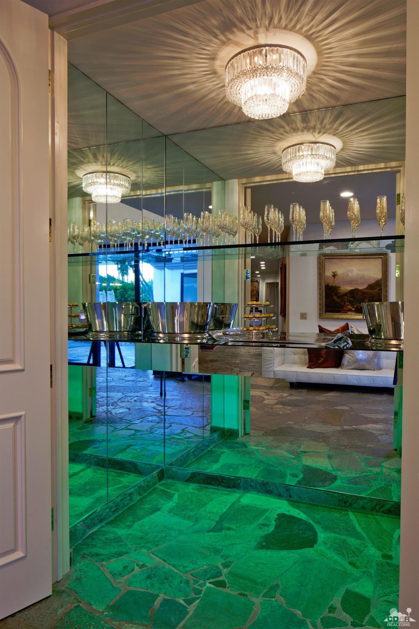 40815 Tonopah Road Rancho Mirage, CA 92270 - Photo 9 of 44 a room with lots of table and chairs