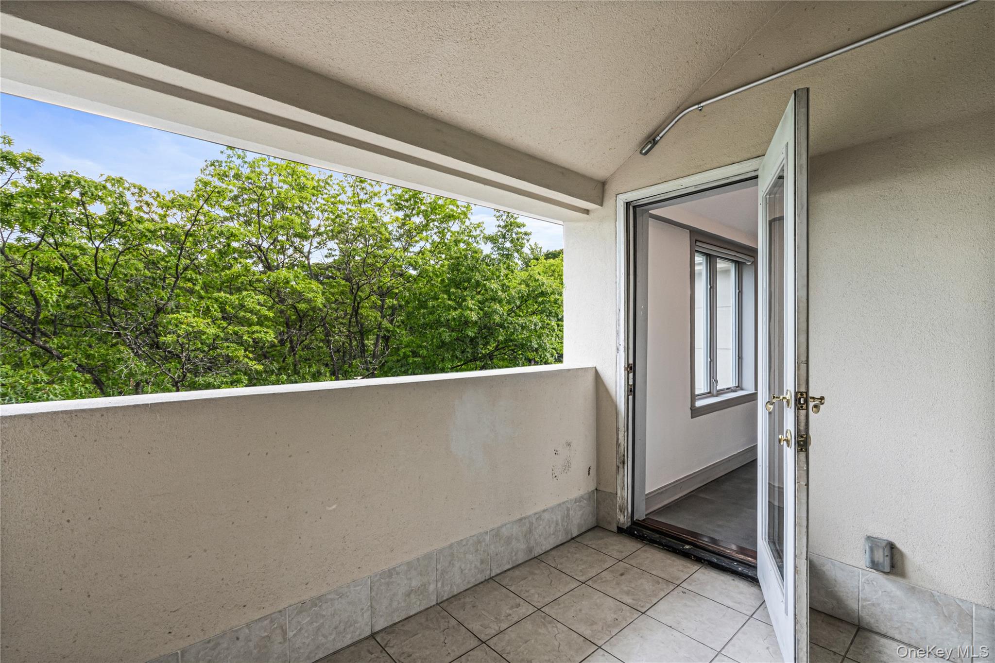 171 Great Neck Road, Unit 4R Great Neck, NY 11021 - Photo 15 of 27 a view of a room that has a window in it
