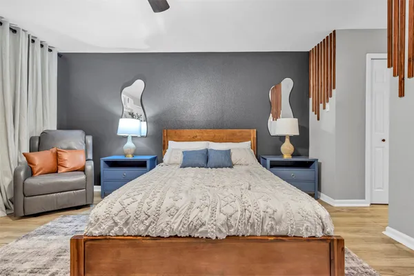 a bedroom with bed and window