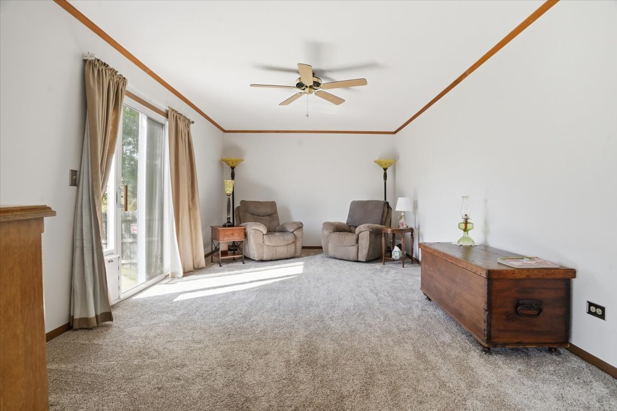 3413 Harbor Ridge Drive Zion, IL 60099 - Photo 10 of 37 a living room with furniture and a chandelier