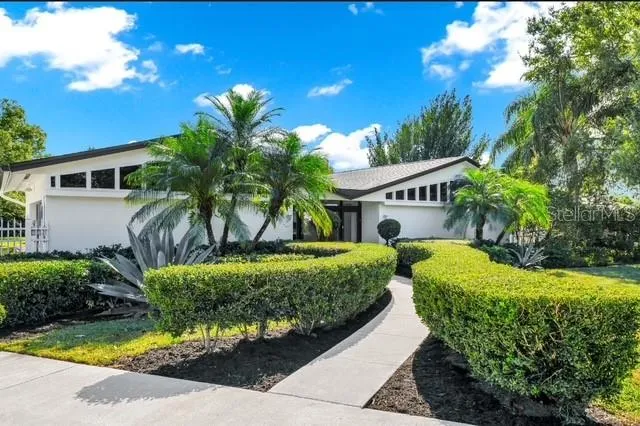 a front view of a house with garden