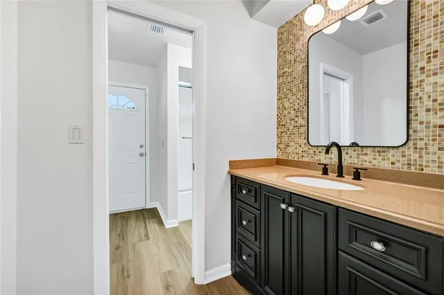 a bathroom with a sink and a mirror