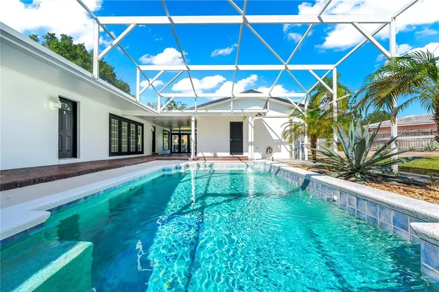 a view of a backyard with a patio and plants