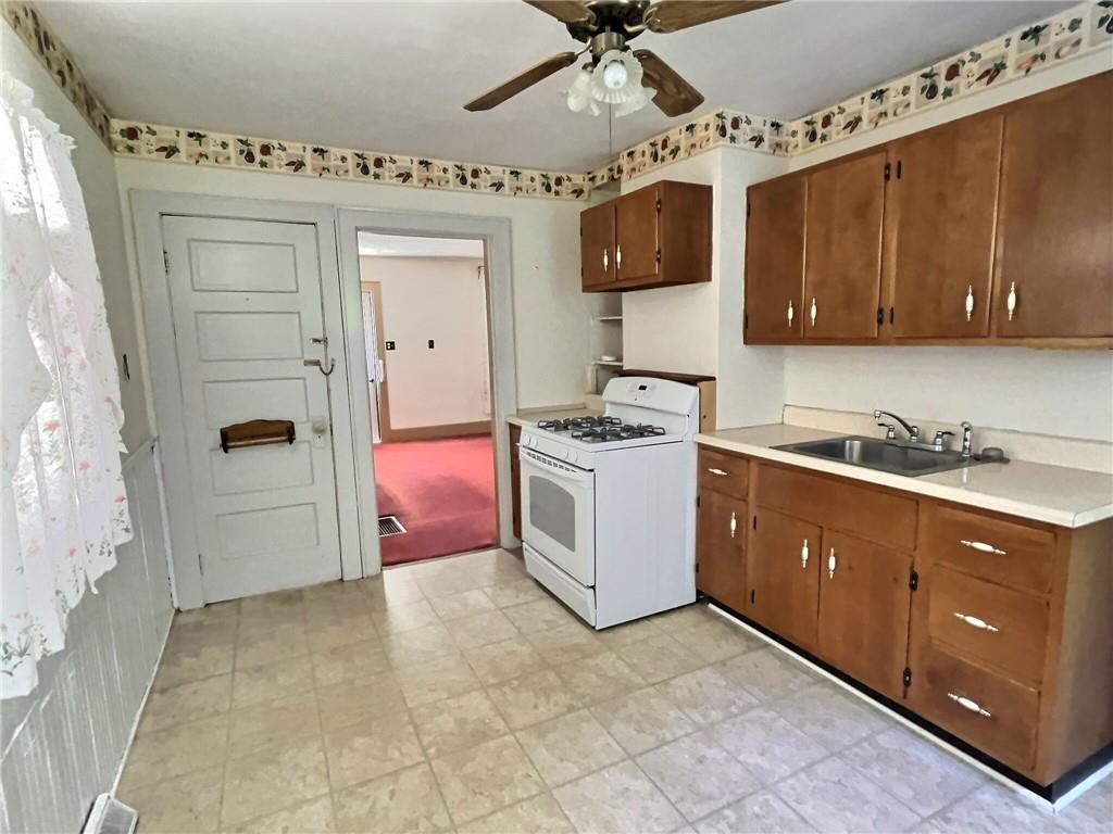 3 Quarry Road Sewickley, PA 15143 - Photo 4 of 18 a kitchen with stainless steel appliances granite countertop a stove a sink and a refrigerator