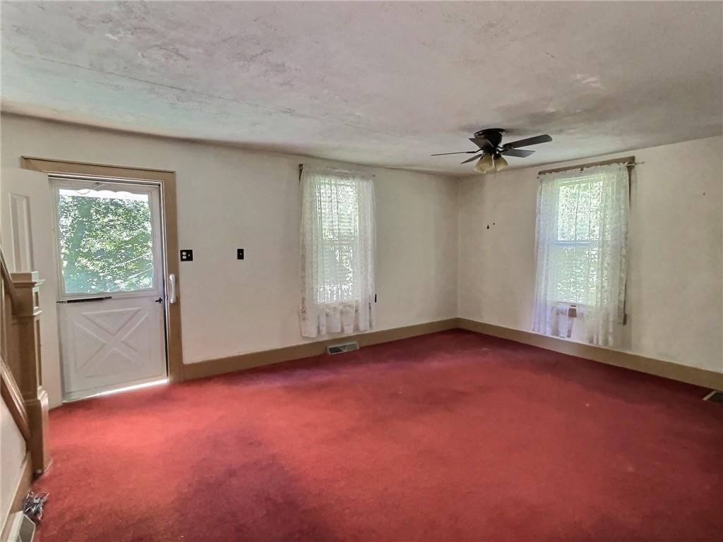 3 Quarry Road Sewickley, PA 15143 - Photo 7 of 18 an empty room with windows and entrance