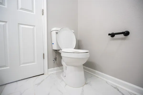 a bathroom with a toilet and a sink