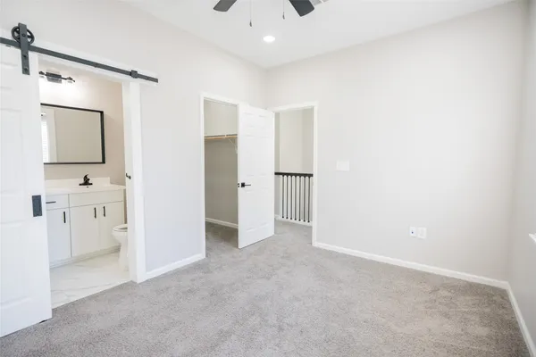 a view of a bathroom with a sink and mirror