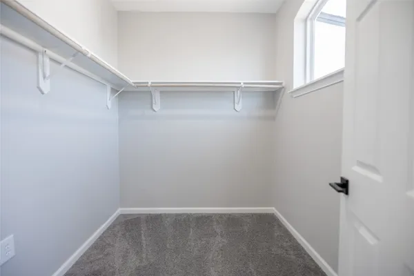 a view of an empty walk in closet