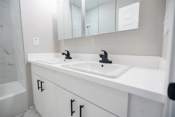 a bathroom with a sink and a bathtub
