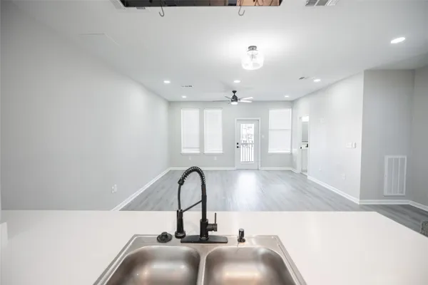 a view of a living room and chandelier