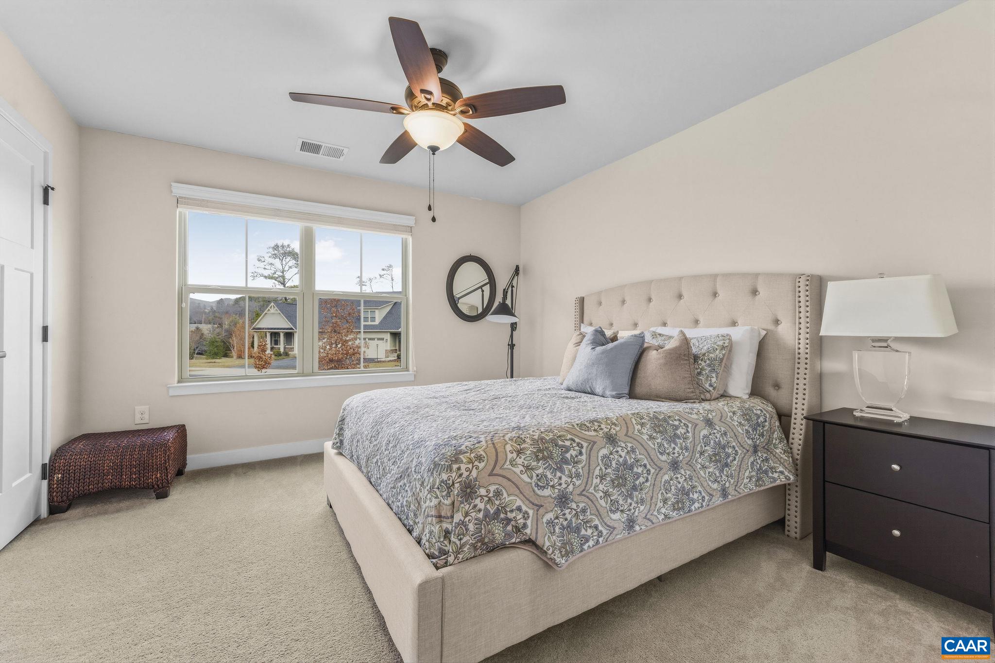 360 Winding Road Keswick, VA 22947 - Photo 37 of 48 a bedroom with a large bed and window