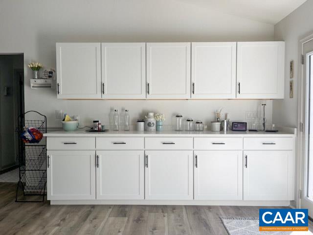 31 Laguna Road Palmyra, VA 22963 - Photo 11 of 39 a kitchen with granite countertop white cabinets and white appliances