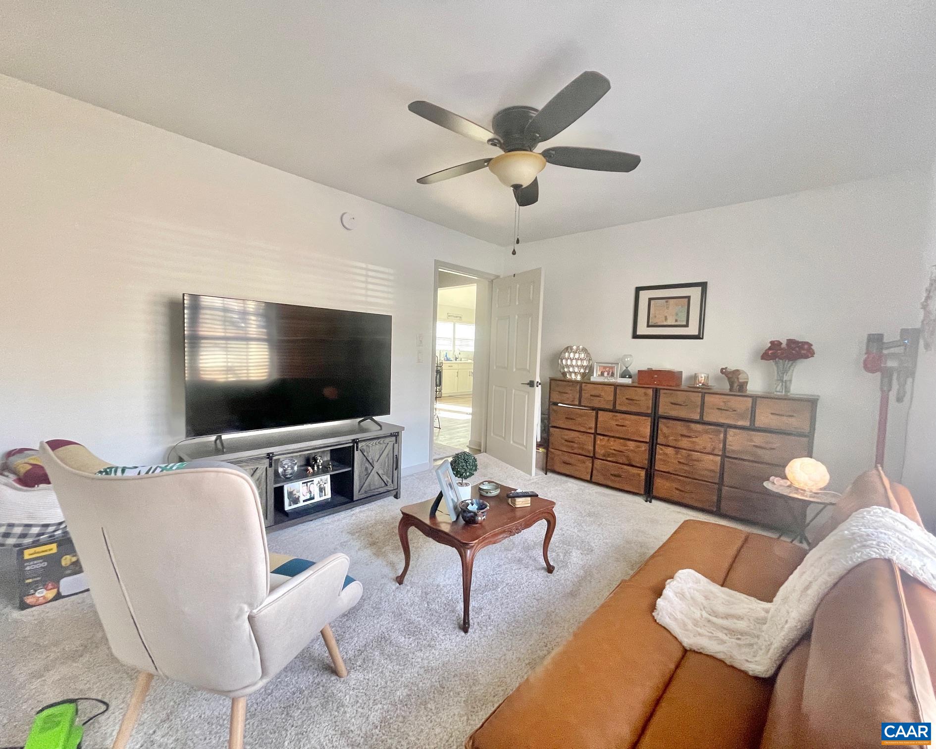 31 Laguna Road Palmyra, VA 22963 - Photo 18 of 39 a living room with furniture and a flat screen tv