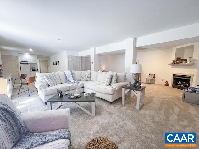 31 Laguna Road Palmyra, VA 22963 - Photo 23 of 39 a living room with furniture a fireplace and a table