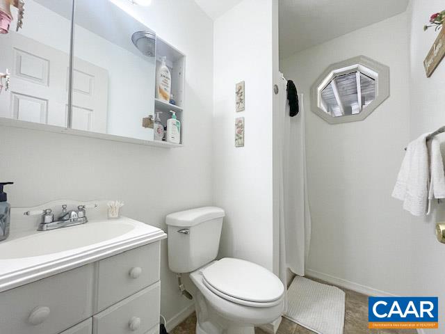 31 Laguna Road Palmyra, VA 22963 - Photo 25 of 39 a white toilet sitting next to a bathroom sink
