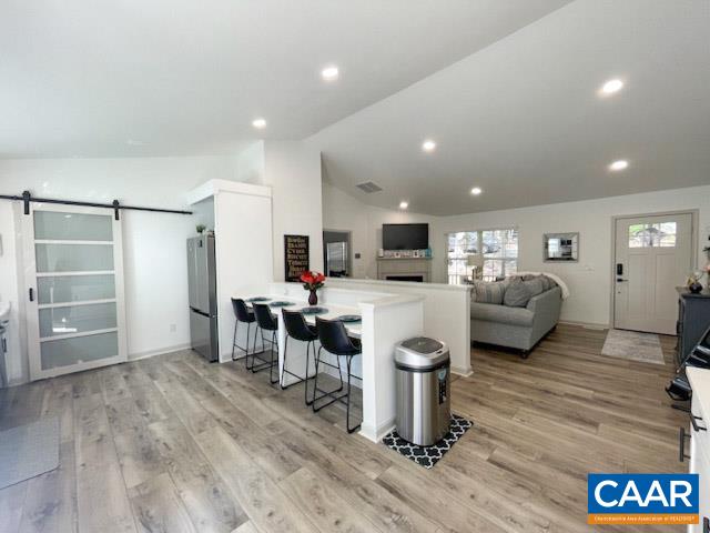 31 Laguna Road Palmyra, VA 22963 - Photo 6 of 39 a living room with furniture and a flat screen tv