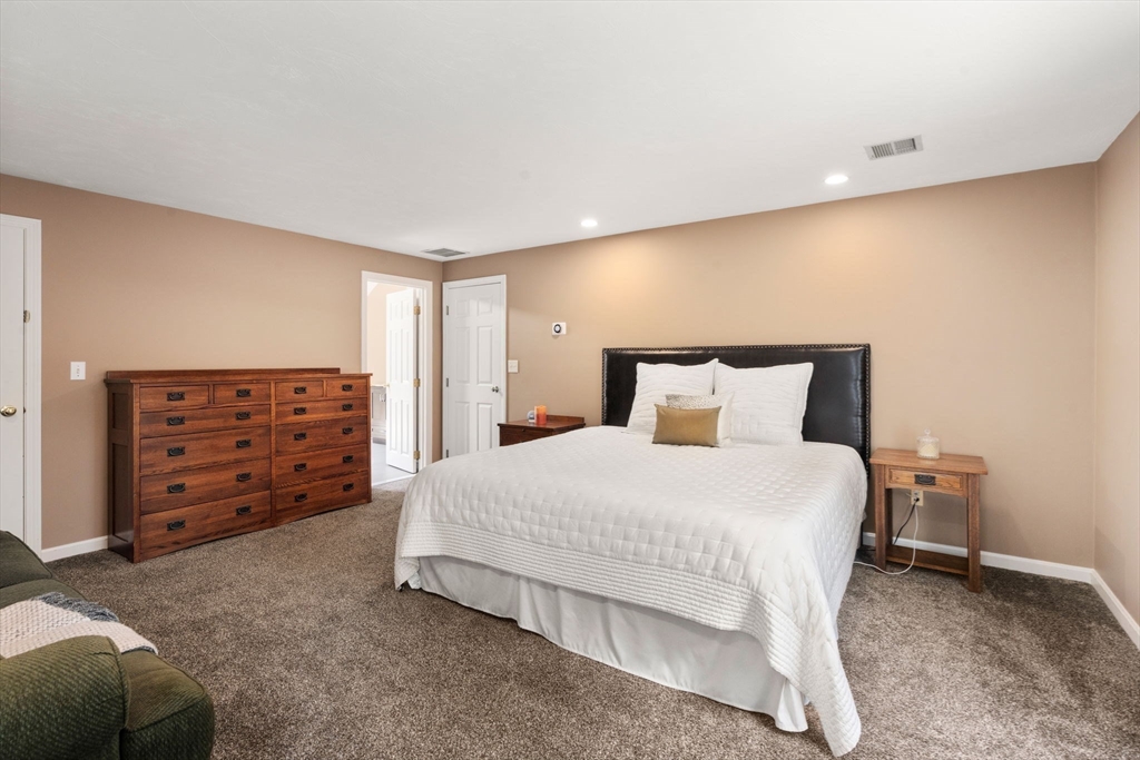 12 Thorny Lea Road Sharon, MA 02067 - Photo 19 of 29 a large bed sitting in a room