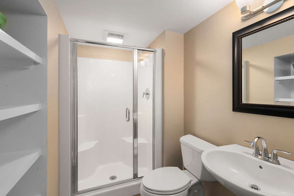 12 Thorny Lea Road Sharon, MA 02067 - Photo 26 of 29 a bathroom with a toilet a sink and a mirror