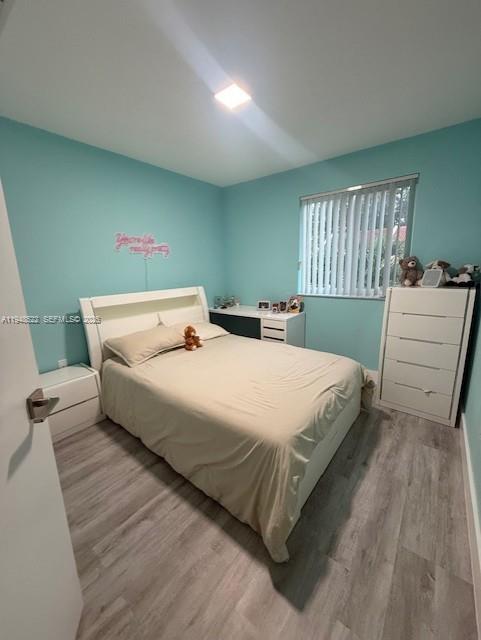 14085 Southwest 179th Terrace Miami, FL 33177 - Photo 11 of 24 a bedroom with a bed and window