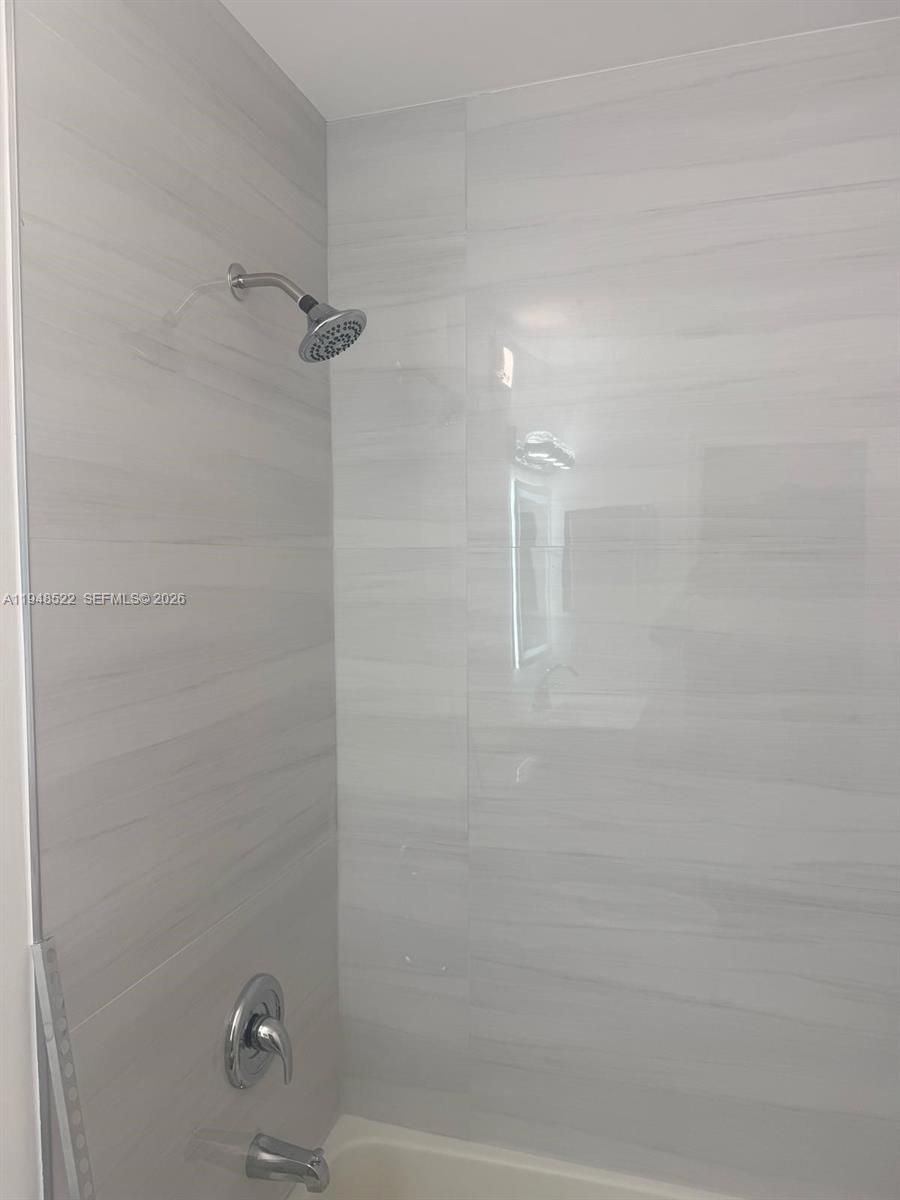 14085 Southwest 179th Terrace Miami, FL 33177 - Photo 13 of 24 a bathroom with a shower