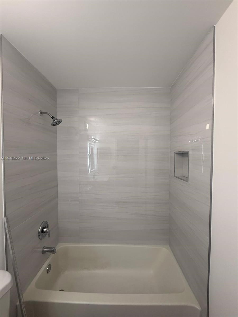 14085 Southwest 179th Terrace Miami, FL 33177 - Photo 14 of 24 a bathroom with a bathtub