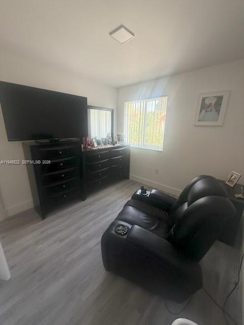 14085 Southwest 179th Terrace Miami, FL 33177 - Photo 18 of 24 a living room with furniture and a flat screen tv