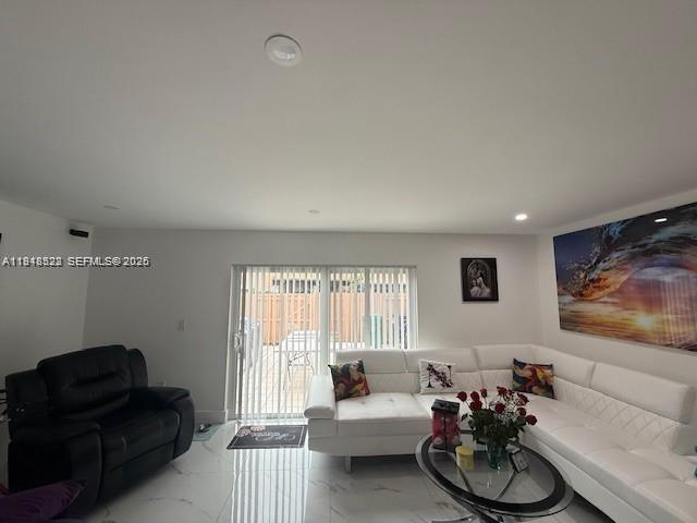14085 Southwest 179th Terrace Miami, FL 33177 - Photo 8 of 24 a living room with furniture and a flat screen tv
