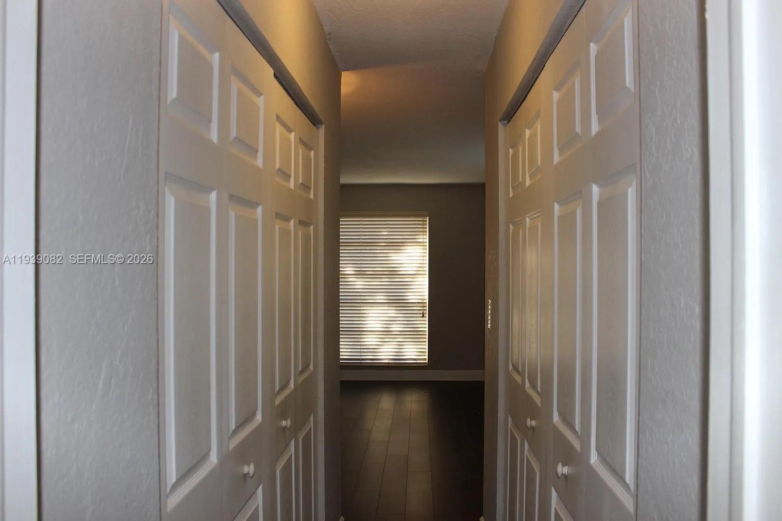 9441 Southwest 76th Street, Unit V33 Miami, FL 33173 - Photo 14 of 21 a view of a hallway